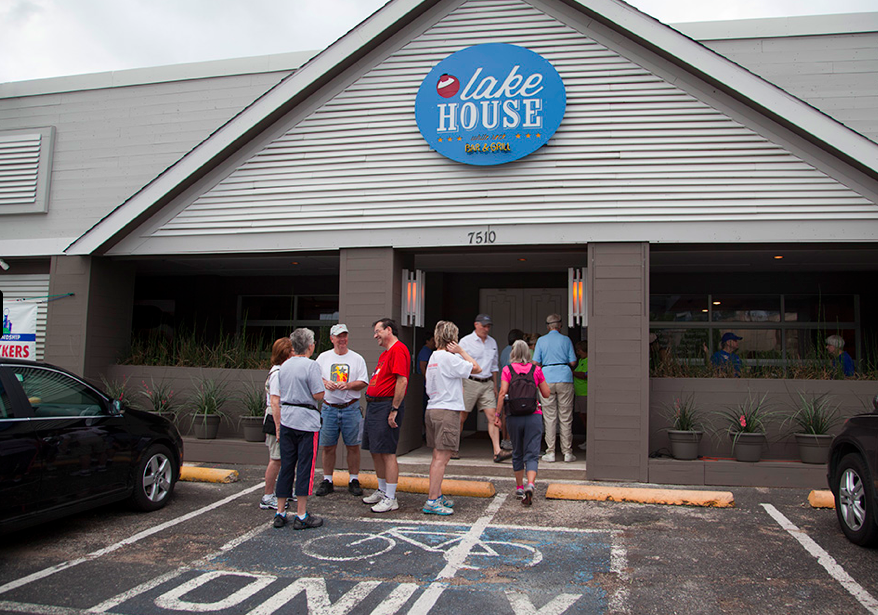 A walking group meets in front of Lake House Bar and Grill: Katie Bernet