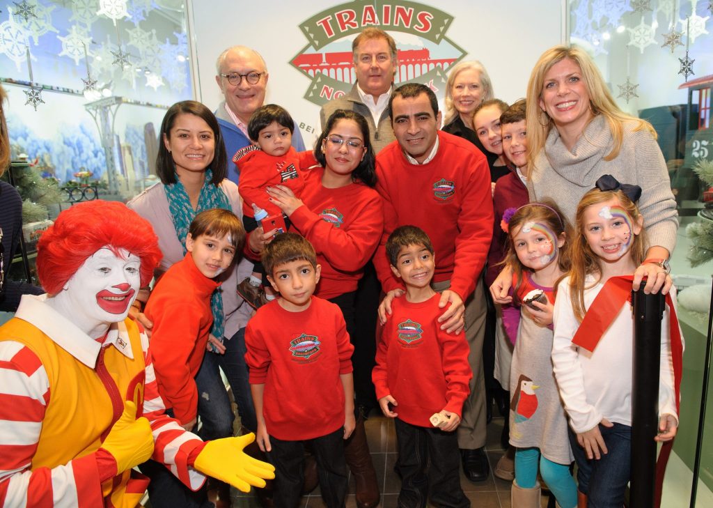 Bob White, Bank of Texas (Presenting Sponsor), Honorary Chairs Pat and Lauren Arthur. Middle row: Trains co-chair Courtney Raggio, Stephen Megally, Heba Megally, Adel Megally, Erin Arthur; Burke Arthur; Trains co-chair Courtney Westerburg.  Front row: Ronald McDonald, William Raggio, Kid Conductor Bishoy Megally, Fady Megally, Hadley Westerburg, Riley Westerburg 