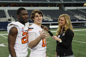Desmond Roland clowns with OSU quarterback Clint Chelf at AT&T Stadium. Photo by Keith Whitmire.