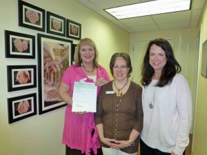 Healing Hands Ministries' Janna Gardner and Melanie Hedrick with LHWL's Kay Strubeck
