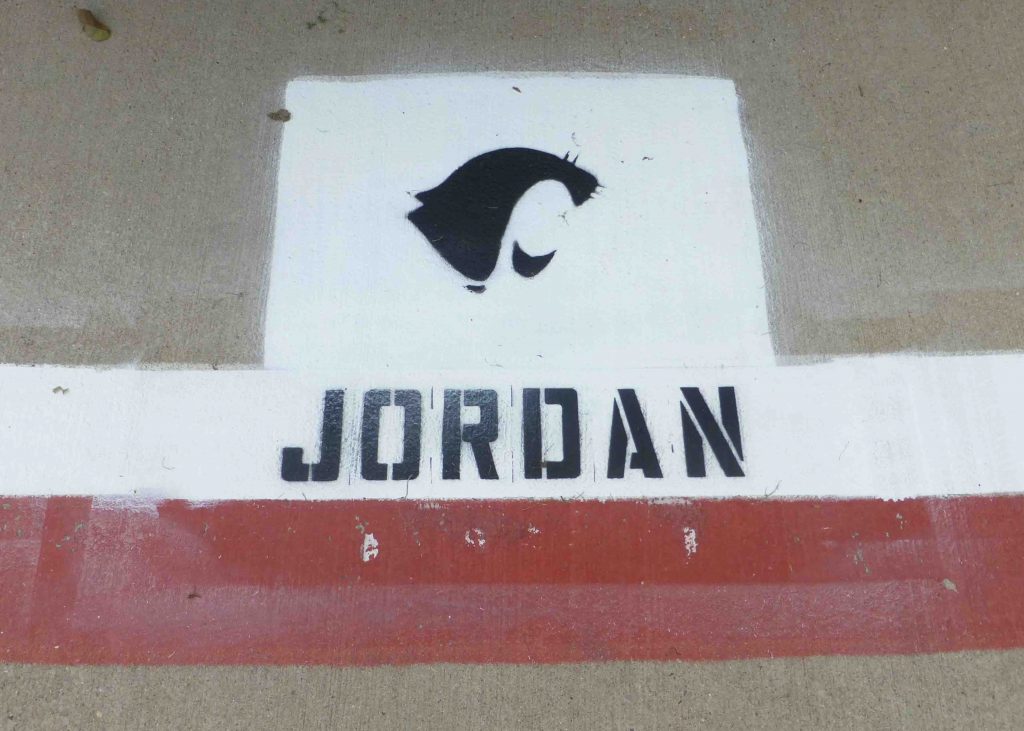 Coach Jordan arrived to find his name already painted on his personal parking space. Photo by Carol Toler.