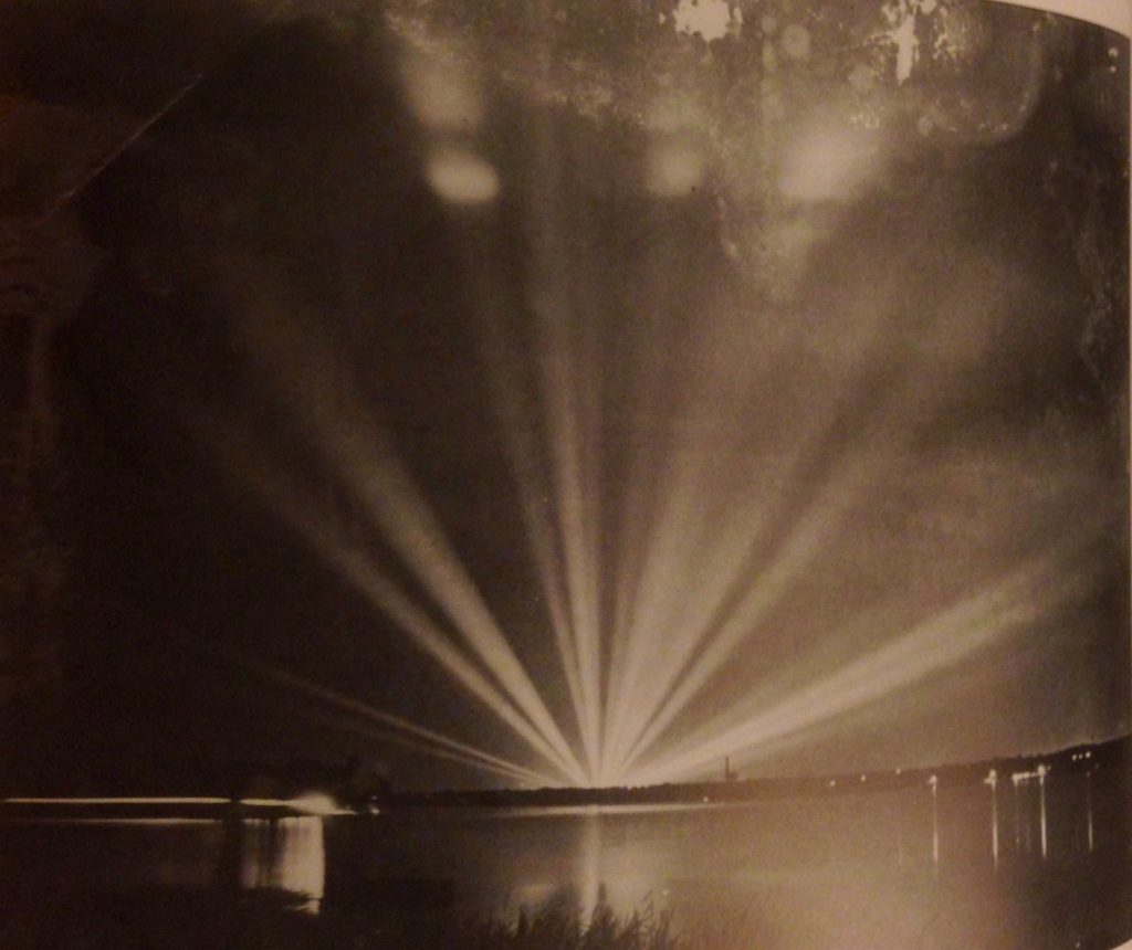 In 1936 the Centennial Exhibition light bank behind the Hall of State at Texas State Fair provided a glorious glow over White Rock Lake. 