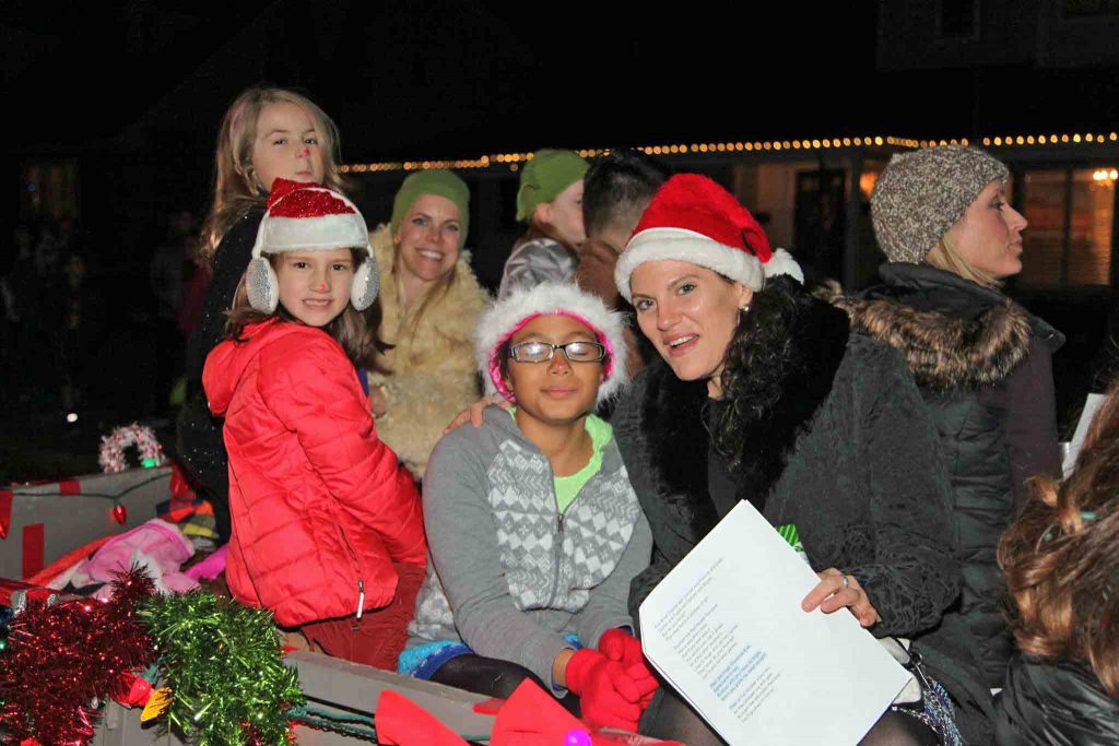 Caren Bright and her daughter, with other carolers.