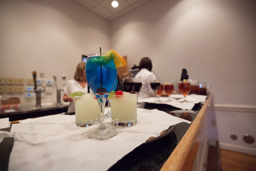 A blue cosmopolitan sitting between two margaritas waiting to be served. (Photo by Rasy Ran)