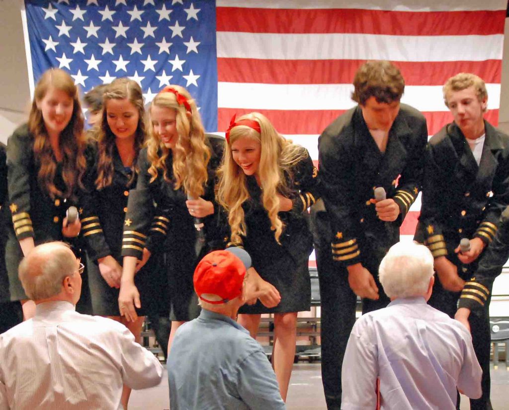 Students greet veterans at a previous show