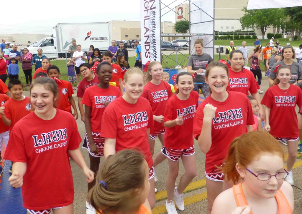 LHJH cheerleaders warm up with Jazzercise before the race