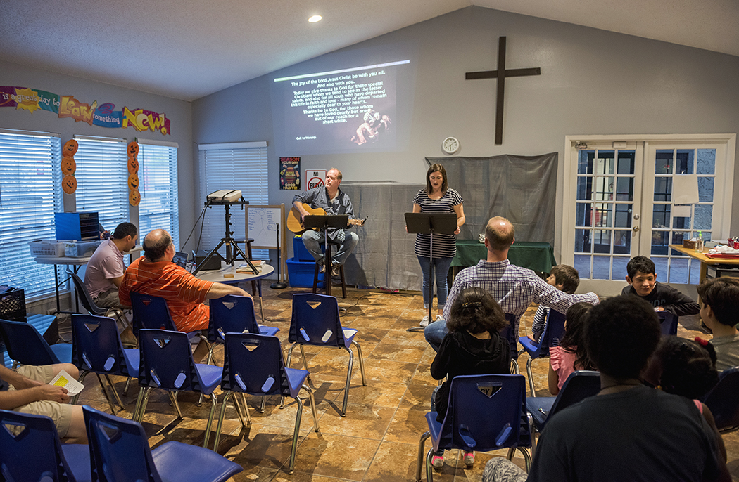 Members of Nexus Community Church bring worship to an apartment complex at Forest Lane and Audelia Road. (Photo by Danny Fulgencio)