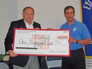 Greg Duval presents check to Roger Moon