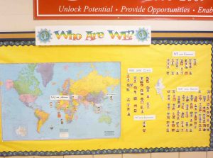A world map indicates how far students have come and the location of their village.