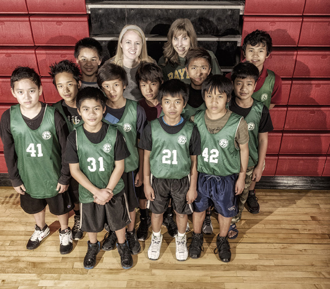 A team of boys from Burma, with help from teachers Allison Beene and Ashley Nick,   dominated their league during their first-ever basketball season: Photo by Danny Fulgencio