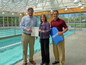 YMCA Aquatic Director Bobby Timmer, LH Women's League Disbursements Chair Julie Jodie and YMCA Executive Director Roger Moon