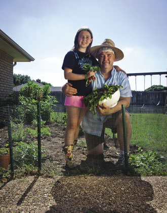 Tom Fleming and daughter Alexandra, 9, in their home garden: Photo by Kim Leeson