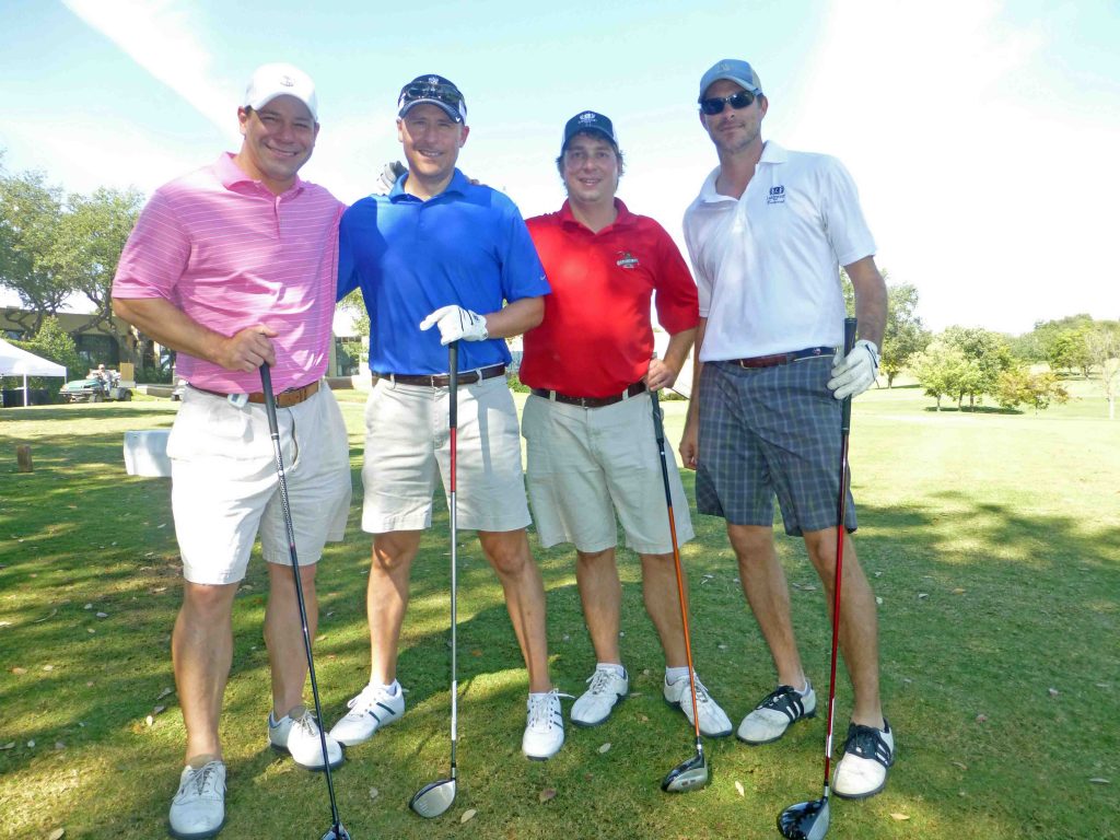 HHM Board Member Chris Thompson (in red) with his foursome