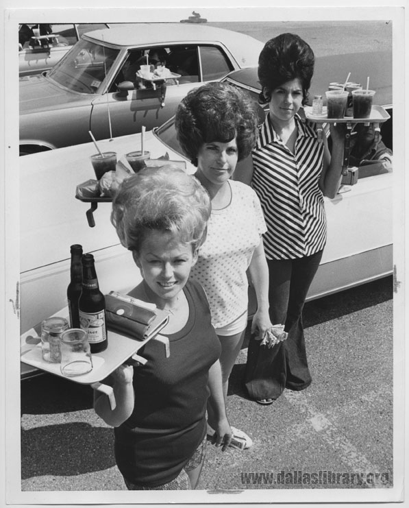 A young Shirley Ehney (middle) poses with two other Keller’s carhops in 1974. From the collections of the Texas/Dallas History and Archives Division, Dallas Public Library