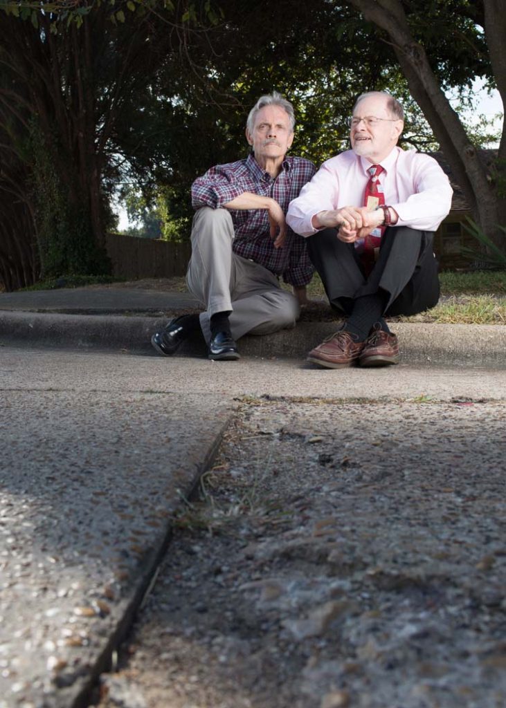 Richland College anthropology professor Tim Sullivan, and history professor Clive Sielge pose for a portrait at the Shoreview Road and Thurgood Lane intersection in Lake Highlands. The pair collaborated in teaching their respective courses surrounding Little Egypt, a post-Civil War community that existed on the boundaries of where they sit. Photo by Rasy Ran