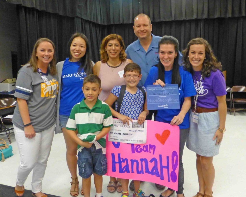 Hannah English with MPE Principal Katie Barrett, parents Lisa and Jeff, brother Cole, Victoria and Tiffany from Make-A-Wish, and fellow leukemia survivor Beth Lyons