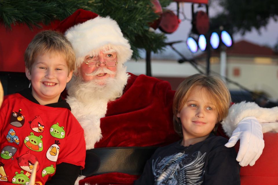 Hexter mom Amy Ford Dyer's son and best friend sit in Santa's lap at a past Casa Linda tree lighting festival. (Photo courtesy Amy Ford Dyer)