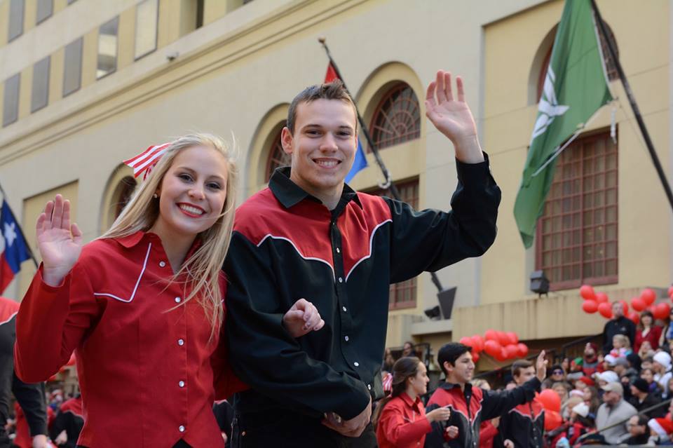 Wranglers wave to parade crowds downtown