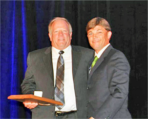 Bob Dubey receives Athletic Director of the Year honors from Trey Schneider of the Texas High School Athletic Directors' Association