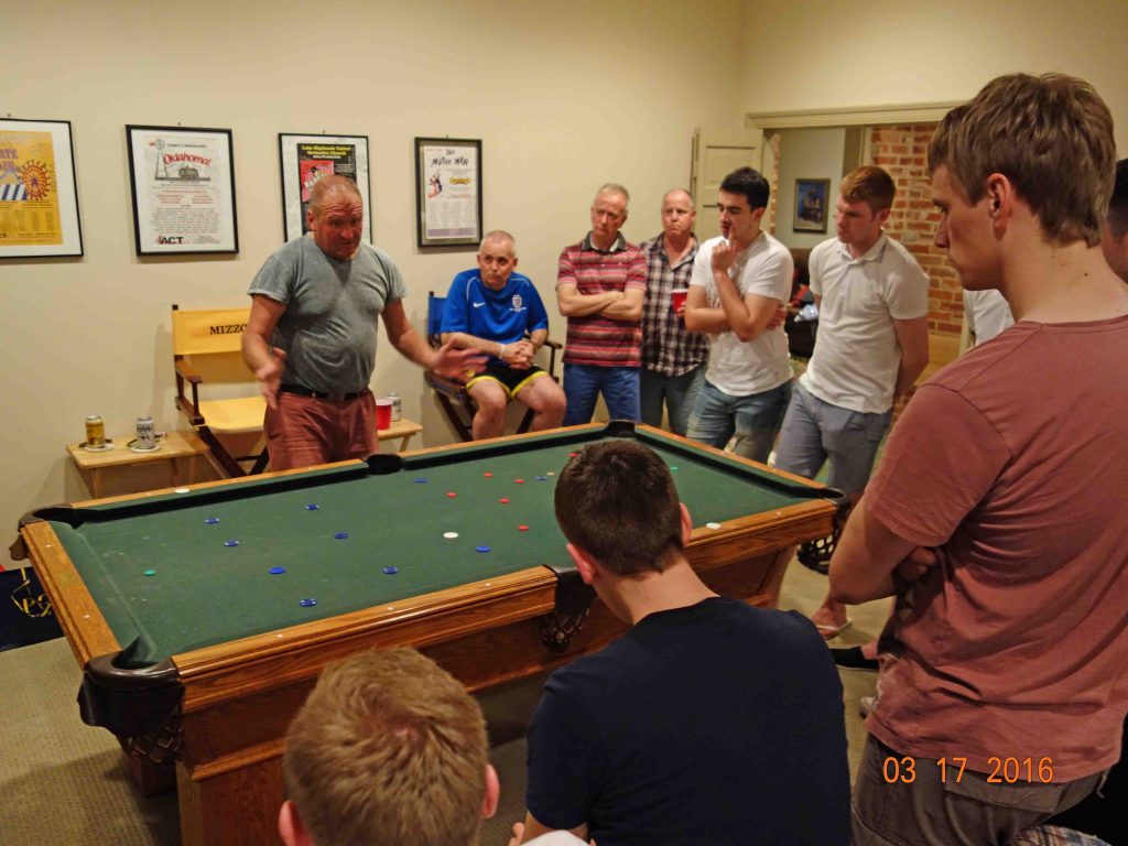 The Tolers' pool table doubles as a soccer field for referee training