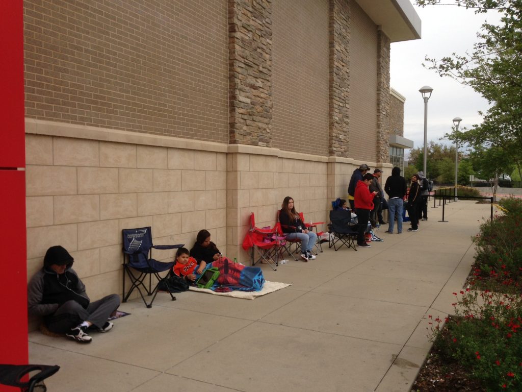 John Cena's fans await his arrival at JCPenney at the Timbercreek Shopping Center.