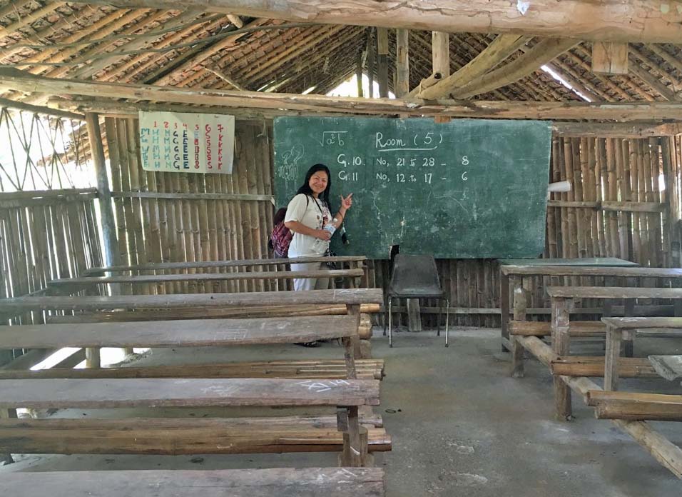 Juna Saw in a refugee camp classroom