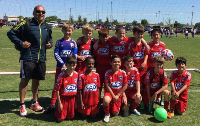 FC Dallas Central team includes kids from across the White Rock Lake area, pictured here with coach Daniel Rivas.
