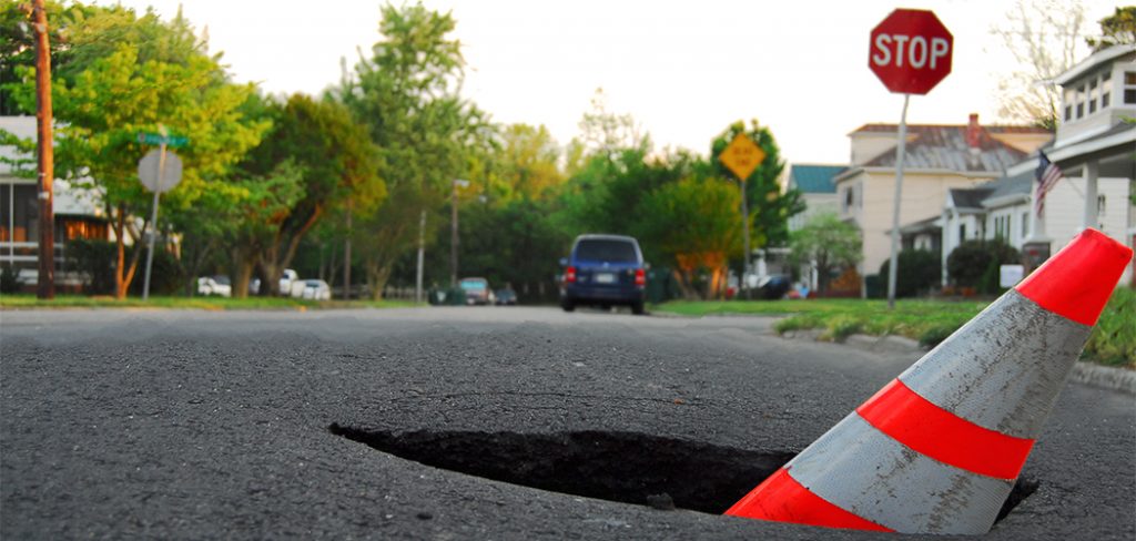 pothole with caution cone