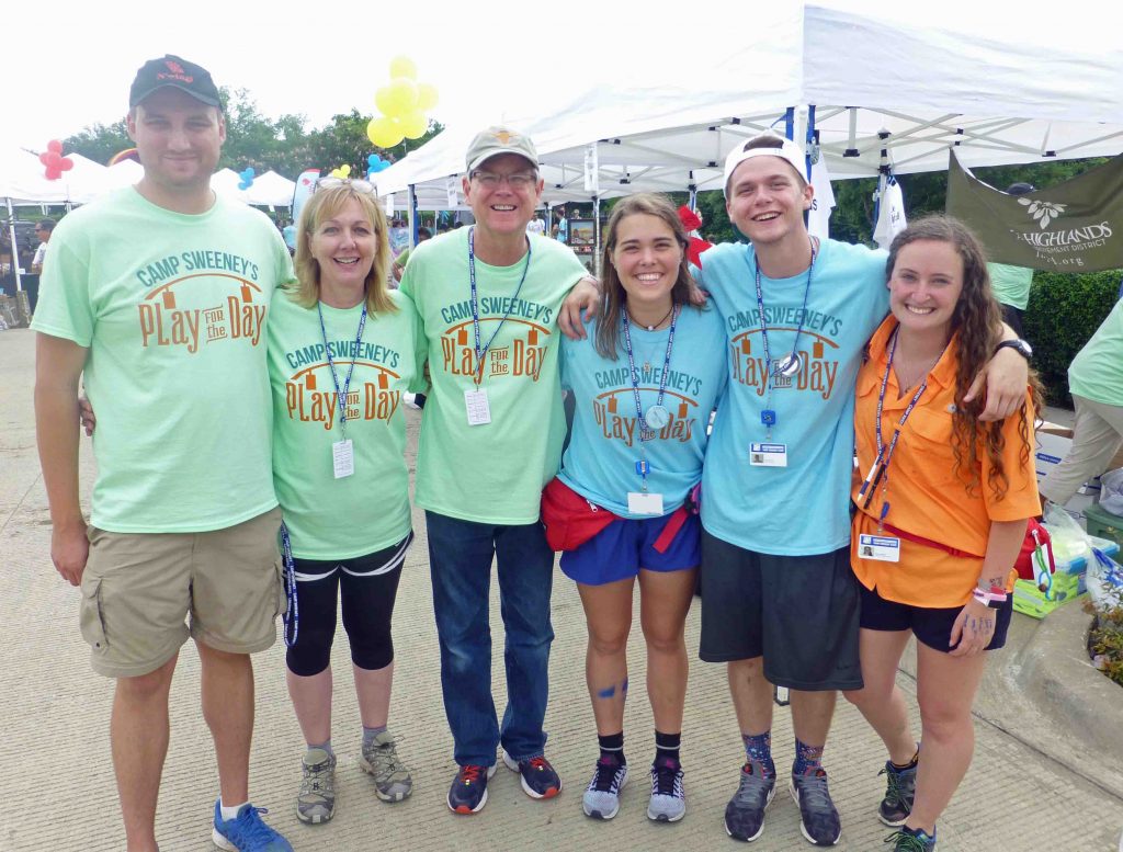 Mary Clare Stewart (in blue) with her parents and fellow Camp Sweeney counselors at Play for the Day