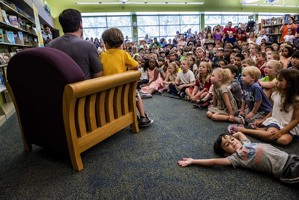 DALLAS, TX 06/07/2016 Entrepreneur and philanthropist Mark Cuban, along with his son, Jake Cuban, read books a gaggle of children at the Audelia Branch Library in Dallas, TX on June 7, 2016 as part of the Mayor’s Summer Reading Club, an initiative to get kids reading during the summer months. Credit: Danny Fulgencio