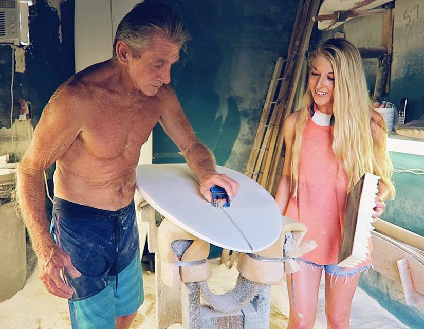 Sarah Penny with surboard shaper Mark Sausen in Kauai