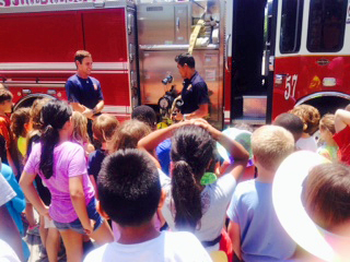 Firefighters from Station 57 teach first aid and fire safety lessons.