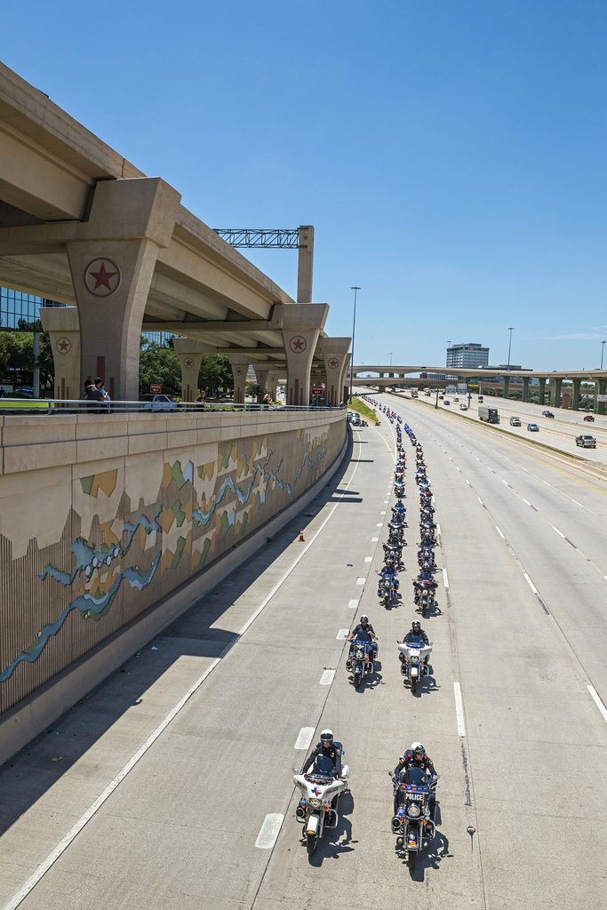 DALLAS, TX 07/14/2016 The funeral procession for Dallas Police Sgt. Michael Smith was seen streaming eastbound on Interstate 635 near Schroeder Rd. on July 14, 2016. Smith, 55, was one of five officers killed during July’s downtown rampage. A civil funeral was held at Watermark Church and Smith was laid to rest at Restland Memorial Park. Credit: Danny Fulgencio