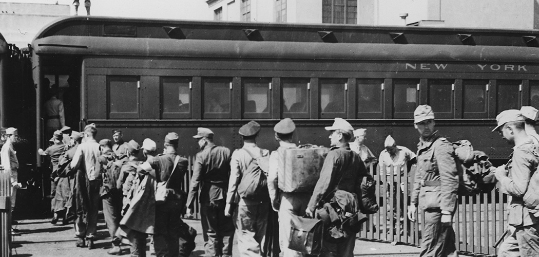 German prisoners of war enter a train car at Mexia in Texas. Some 200,000 German P.O.W.s were housed in Texas from 1943-45. Below, German P.O.W.s were paid 80 cents per day in canteen coupons. (Images courtesy of the Friends of Camp Hearne)