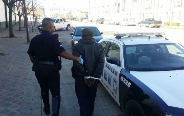 Dallas police arrest a panhandler earlier this year. (Photo from DPDBeat.com)