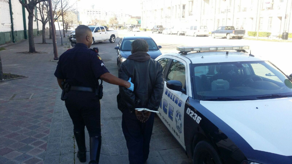 Dallas police arrest a panhandler earlier this year. (Photo from DPDBeat.com) 