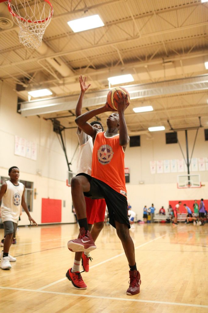 Ikechi Umeh goes in for a layup at Lake Highland’s Family YMCA. (Photo by Rasy Ran)