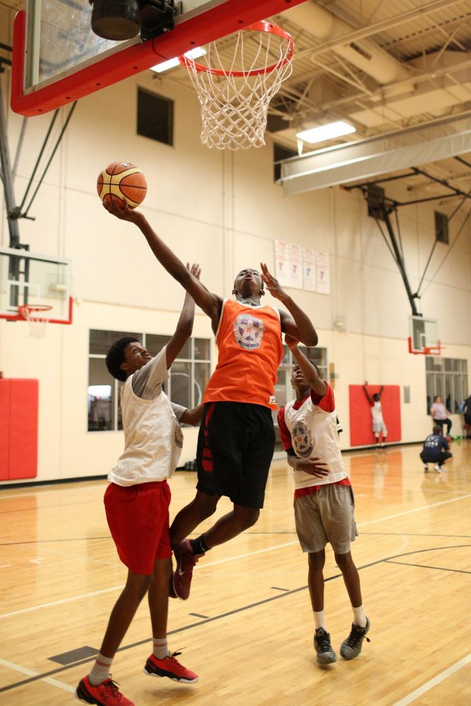 Ikechi Umeh goes in for a layup at Lake Highland’s Family YMCA. (Photo by Rasy Ran)