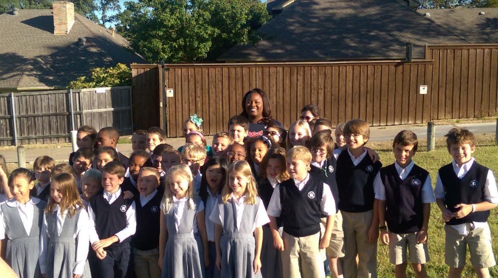 Olympic shot putter Michelle Carter chats with Scofield Christian School students.