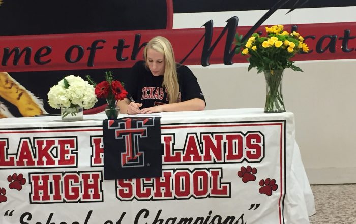 Haley Harman, captain of the LHHS girls volleyball team, pledges to play for Texas Tech. (Photo by Tate Martin)