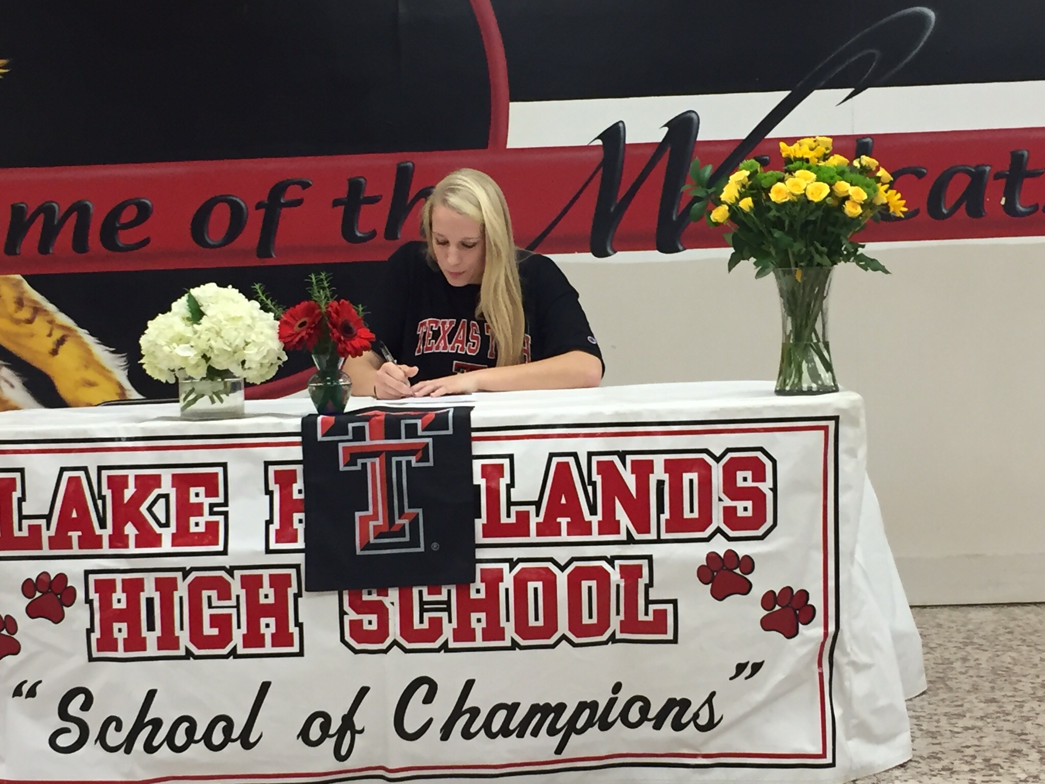 Haley Harman, captain of the LHHS girls volleyball team, pledges to play for Texas Tech. (Photo by Tate Martin)