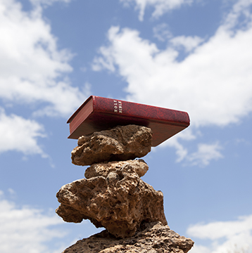 Bible on stack of stones for balance concept