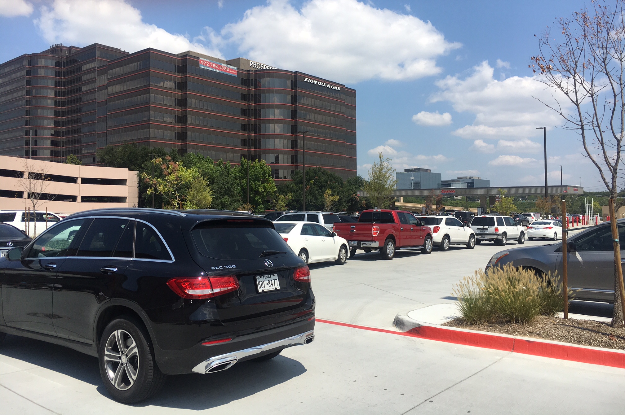 Fear of a fuel shortage after Harvey led hundreds to flock to gas stations, causing pandemonium at the pumps. At the Costco on Coit, cars snaked in every direction. (Photo by Emily Charrier)