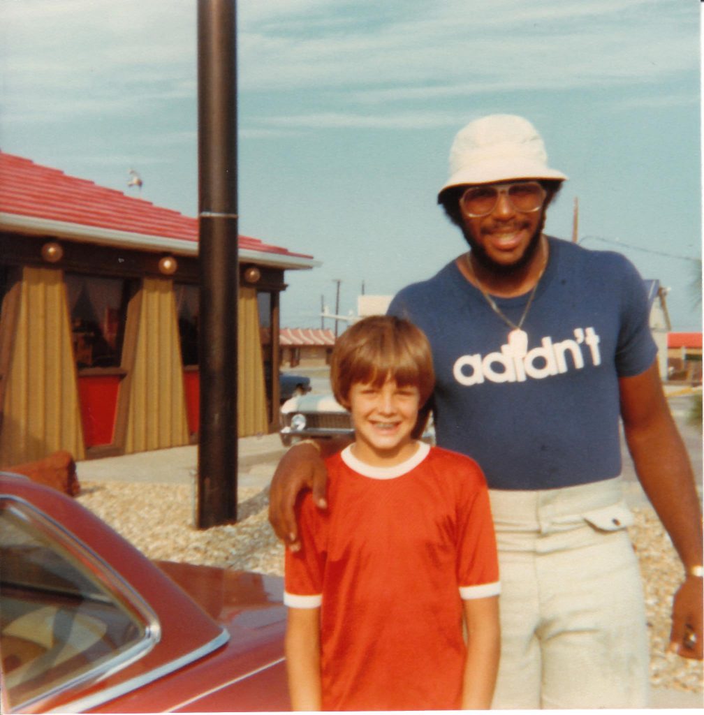 kids used to hang out at the Cowboys’ practice facility on Forest Lane at Abrams Road, hoping to meet players. Here, John Loveland met defensive end Harvey Martin in 1979. (Photo courtesy of John Loveland). 