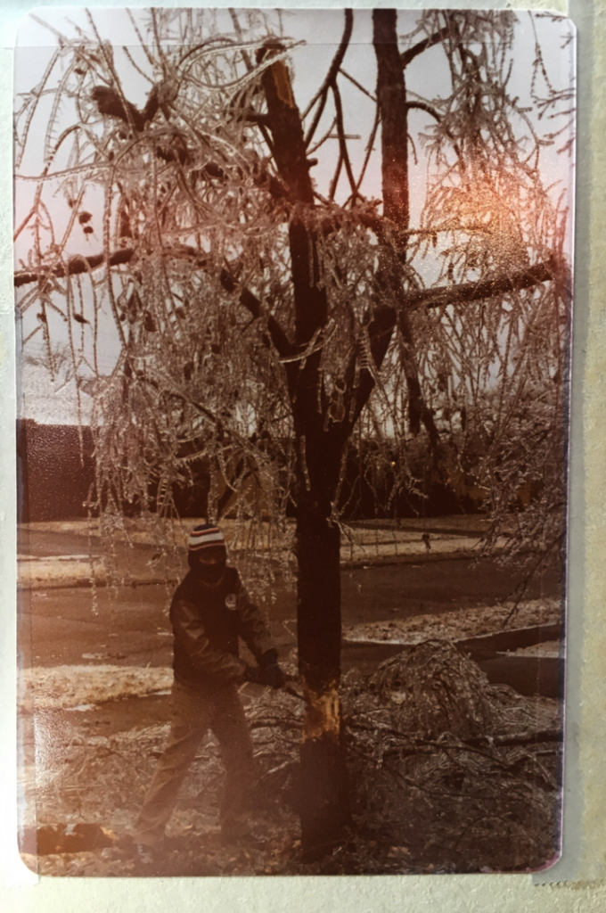 An 11-year-old Terry Irwin chops down a frozen tree during the ice storm in 1979. (Photo courtesy of Linda Irwin) 