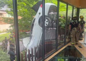 Steel pickets save driver (and house) in cartwheel crash near White Rock Lake